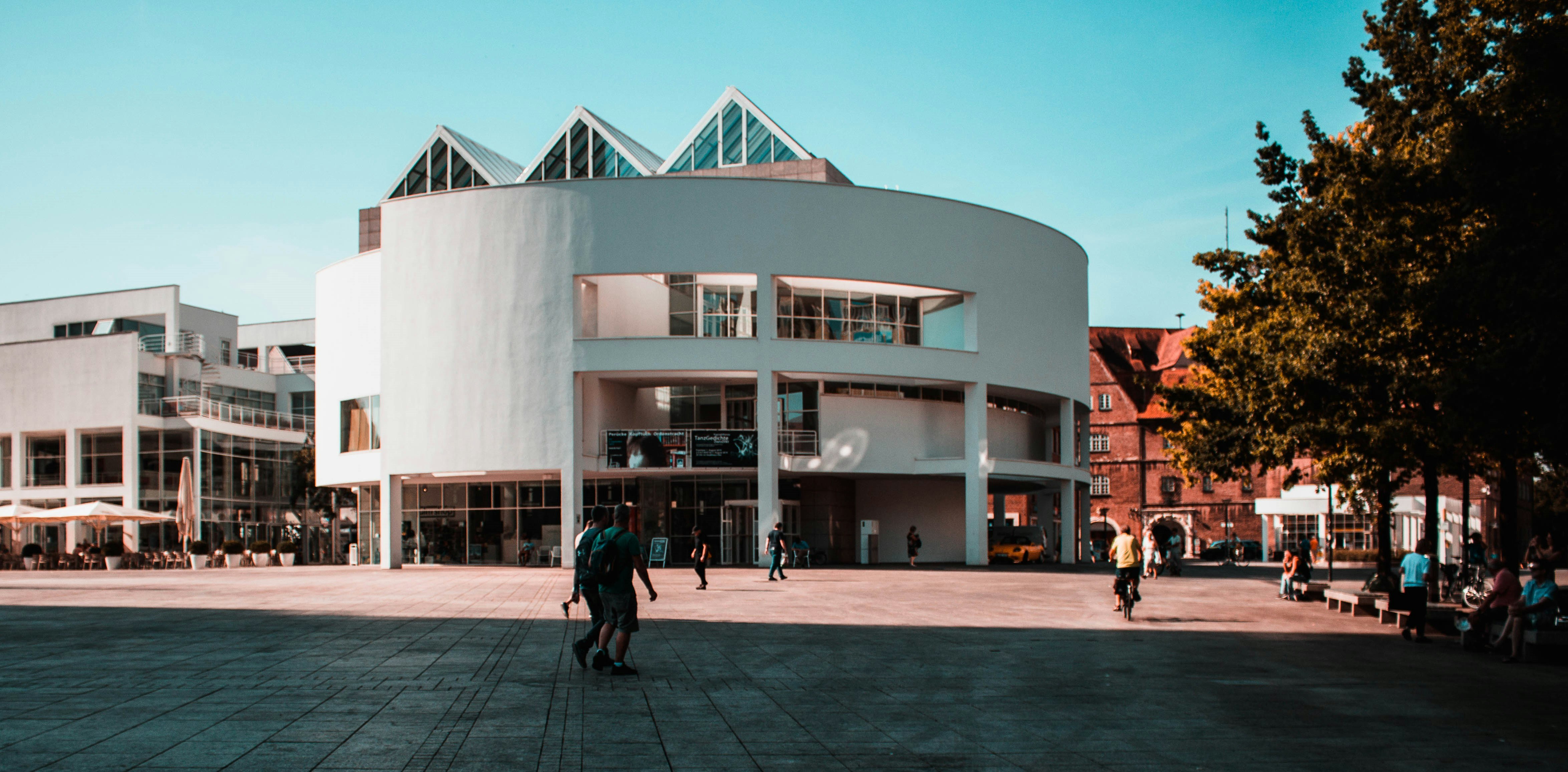 white and black concrete building under blue sky at daytime